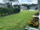 Well-manicured lawn with colorful flowers at 4739 Spring Grove Ln, Leesburg, Fl, FL 34748