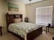 Bedroom with a full-size bed, dresser, and ceiling fan at 4739 Spring Grove Ln, Leesburg, Fl, FL 34748