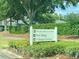Sign shows locations of Welcome Center, Pro Shop, and Village Green at 4739 Spring Grove Ln, Leesburg, Fl, FL 34748