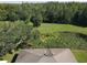 Aerial view showing home, pond, and surrounding land at 3040 Rambler Ave, Saint Cloud, FL 34772