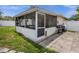 Screened patio and grilling station in backyard at 2032 Grasmere Dr, Apopka, FL 32703