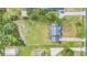 Aerial view showing house, large yard, and surrounding neighborhood at 7055 Big Bend Dr, Saint Cloud, FL 34771