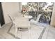 Screened balcony with patio furniture and view of trees at 5300 S Atlantic Ave # 8-207, New Smyrna Beach, FL 32169