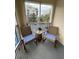 Relaxing screened balcony with rocking chairs and view of community at 5300 S Atlantic Ave # 8-207, New Smyrna Beach, FL 32169