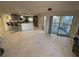 Open living room and kitchen with spacious feel and marble flooring at 5300 S Atlantic Ave # 8-207, New Smyrna Beach, FL 32169