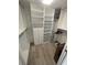 Spacious walk-in closet with ample shelving and hanging space at 5300 S Atlantic Ave # 8-207, New Smyrna Beach, FL 32169
