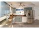 Open kitchen with granite countertops and stainless steel appliances at 5300 S Atlantic Ave # 8-207, New Smyrna Beach, FL 32169