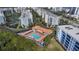 Aerial view of community pool and surrounding buildings at 5300 S Atlantic Ave # 8-207, New Smyrna Beach, FL 32169