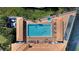 Aerial view of community pool with surrounding loungers at 5300 S Atlantic Ave # 8-207, New Smyrna Beach, FL 32169