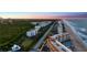 Aerial view of community and coastline at sunset at 5300 S Atlantic Ave # 8-207, New Smyrna Beach, FL 32169