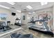 Fitness center with multiple treadmills and mirrors at 5300 S Atlantic Ave # 8-207, New Smyrna Beach, FL 32169