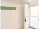 Beach-themed condo entry with white door and 'Beach House' sign at 5300 S Atlantic Ave # 8-207, New Smyrna Beach, FL 32169