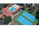 Aerial view of community pool, tennis courts, shuffleboard at 5300 S Atlantic Ave # 8-207, New Smyrna Beach, FL 32169