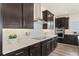 Modern kitchen with herringbone backsplash and stainless steel appliances at 1967 Spring Shower Cir, Kissimmee, FL 34744