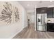 Bright and airy entryway with hardwood floors and access to kitchen at 1967 Spring Shower Cir, Kissimmee, FL 34744