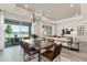 Open concept dining room with view of backyard and lake at 1967 Spring Shower Cir, Kissimmee, FL 34744