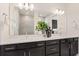 Elegant bathroom with double vanity, quartz countertop and large mirror at 1967 Spring Shower Cir, Kissimmee, FL 34744