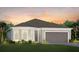 Two-story house with gray roof and garage at 1967 Spring Shower Cir, Kissimmee, FL 34744