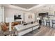 Open living space with modern furniture and a view into the kitchen at 1967 Spring Shower Cir, Kissimmee, FL 34744