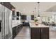 Modern kitchen with stainless steel appliances and dark wood cabinets at 1967 Spring Shower Cir, Kissimmee, FL 34744