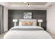 Spacious bedroom with a large bed, stylish wall decor, and plenty of natural light at 1967 Spring Shower Cir, Kissimmee, FL 34744