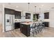 Modern kitchen with dark cabinets, white countertops, and an island at 1967 Spring Shower Cir, Kissimmee, FL 34744