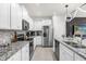 Modern kitchen with stainless steel appliances and granite countertops at 3954 Lana Ave, Davenport, FL 33897