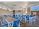 Community dining area with blue and white chairs at 3954 Lana Ave, Davenport, FL 33897