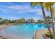 Relaxing resort pool with a shallow area and surrounding landscaping at 3954 Lana Ave, Davenport, FL 33897