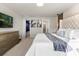 Spacious main bedroom with a king-size bed and access to bathroom at 3954 Lana Ave, Davenport, FL 33897
