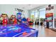 Fun game room with air hockey, basketball game, and various arcade games at 3954 Lana Ave, Davenport, FL 33897