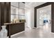Entryway with a modern wood accent wall and tile flooring at 3954 Lana Ave, Davenport, FL 33897