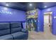 Basement home theater with Avatar mural and comfortable seating at 3954 Lana Ave, Davenport, FL 33897