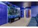Home theater with large screen, Avatar mural, and blue lighting at 3954 Lana Ave, Davenport, FL 33897