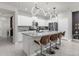 Modern kitchen with white cabinets, granite countertops, and island at 3954 Lana Ave, Davenport, FL 33897