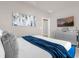 Serene bedroom with a king-size bed and blue accents at 3954 Lana Ave, Davenport, FL 33897