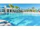Large resort-style pool with plenty of lounge chairs and umbrellas at 3954 Lana Ave, Davenport, FL 33897