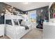 bedroom with bunk beds, Disney mural, and a view at 3954 Lana Ave, Davenport, FL 33897