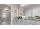 Bathroom with granite countertop, double sinks, and shower at 3954 Lana Ave, Davenport, FL 33897
