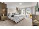 Luxurious main bedroom with a large bed and neutral color scheme at 3954 Lana Ave, Davenport, FL 33897