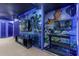 Immersive theater room with vibrant wall art and LED lighting at 3954 Lana Ave, Davenport, FL 33897