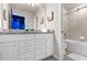Bathroom with granite countertop, double sinks, and bathtub at 3954 Lana Ave, Davenport, FL 33897