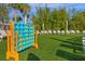 Community lawn with Connect Four game and lounge chairs at 3954 Lana Ave, Davenport, FL 33897