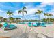 Relaxing resort pool with beach entry, lounge chairs, and hammock at 2984 Salted Rim Rd, Kissimmee, FL 34747