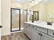 Bathroom with shower and double vanity at 2984 Salted Rim Rd, Kissimmee, FL 34747