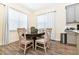 Bright dining area with a round table and six chairs at 2984 Salted Rim Rd, Kissimmee, FL 34747
