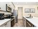 Modern kitchen featuring stainless steel appliances and a large island at 2984 Salted Rim Rd, Kissimmee, FL 34747