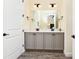 Bathroom with double vanity and a large mirror at 2984 Salted Rim Rd, Kissimmee, FL 34747
