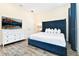 Main bedroom with a king-size bed and large dresser at 2984 Salted Rim Rd, Kissimmee, FL 34747