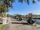 Scenic waterfront walkway with benches and historical markers at 6519 Waterlily Pl, Haines City, FL 33844